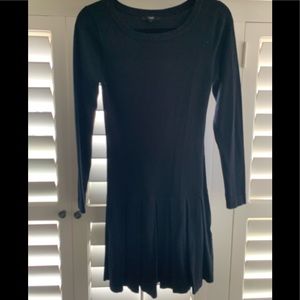 Black sweater dress with pleated skirt